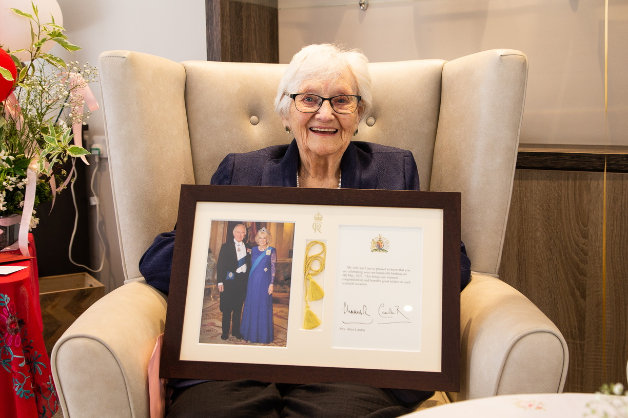 Mrs Alice Larden with her 100th birthday card from the King and Queen